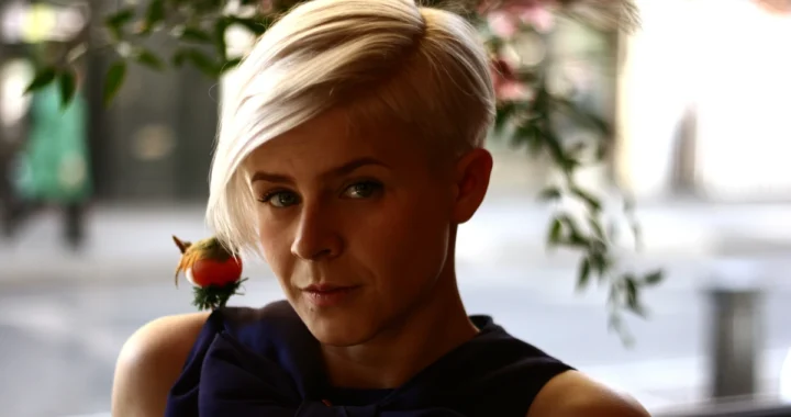 Portrait of Robyn in window light, looking at the camera