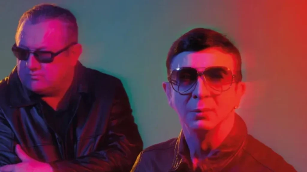 Dave Ball and Marc Almond of Soft Cell in red and green club lighting